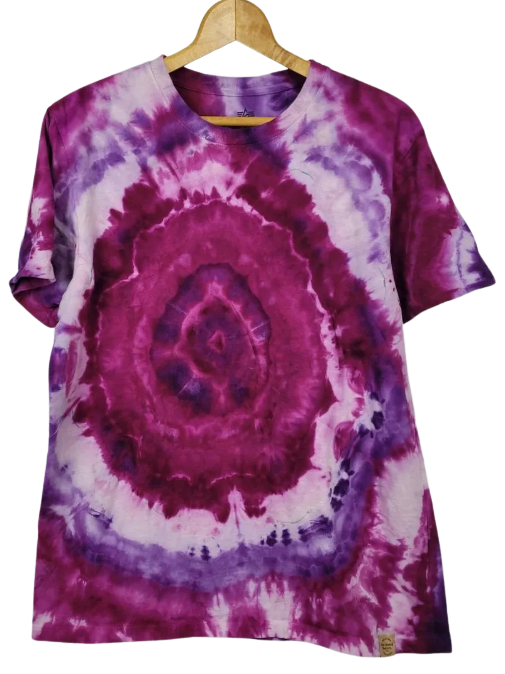 Tie-dye t-shirt with purple and pink spiral pattern on a hanger