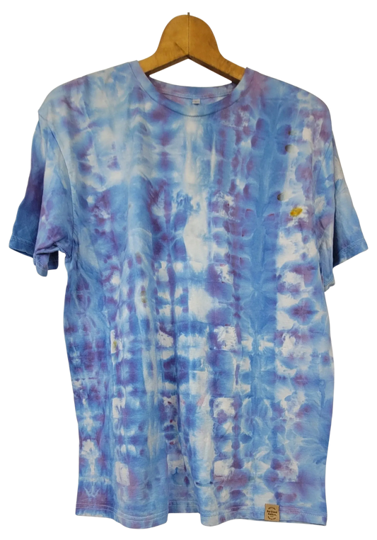 Tie-dye t-shirt on a wooden hanger with a white background