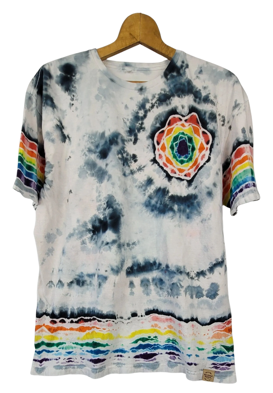 Tie-dye t-shirt with rainbow patterns and a colorful circular design on a hanger.