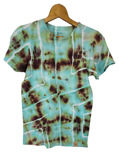 Geometric brown and teal tie dye t-shirt on hanger