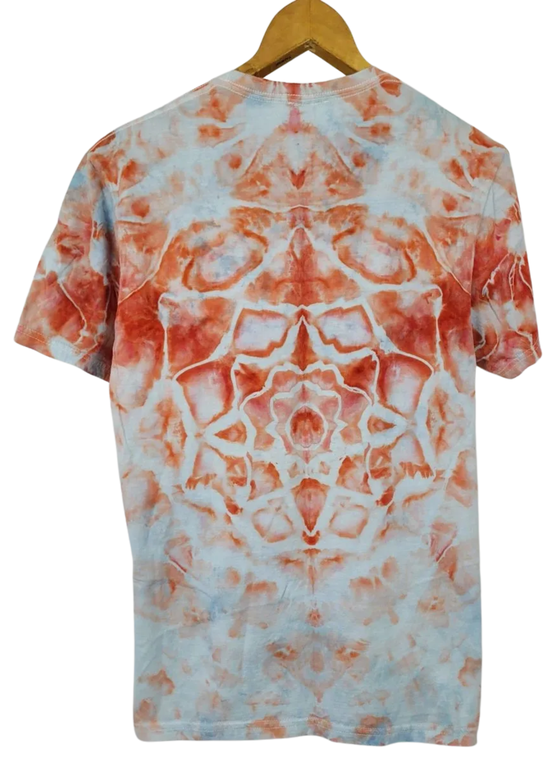 Tie-dye t-shirt with orange and white pattern on a hanger