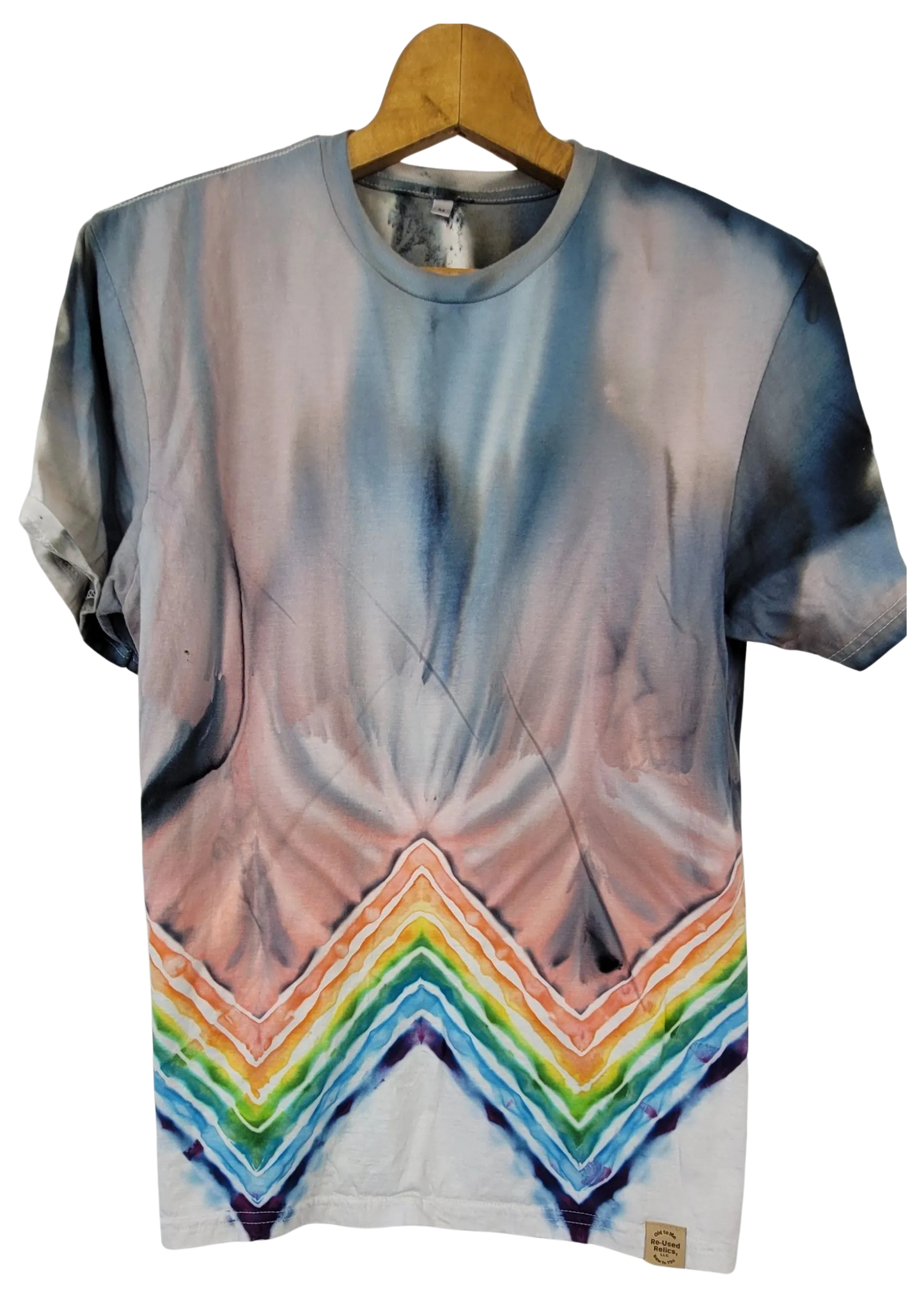T-shirt with abstract design and rainbow pattern on a hanger