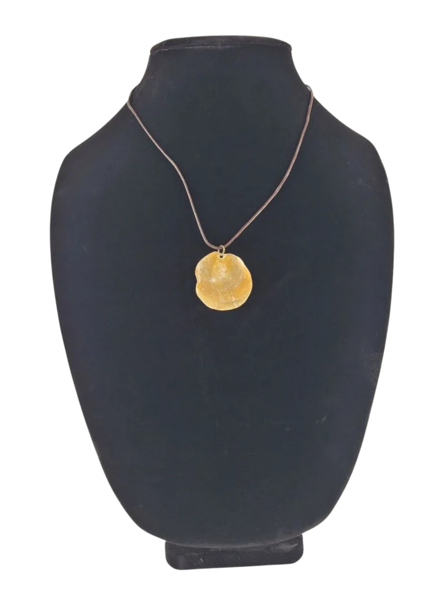 necklace with a pendant on a black mannequin bust