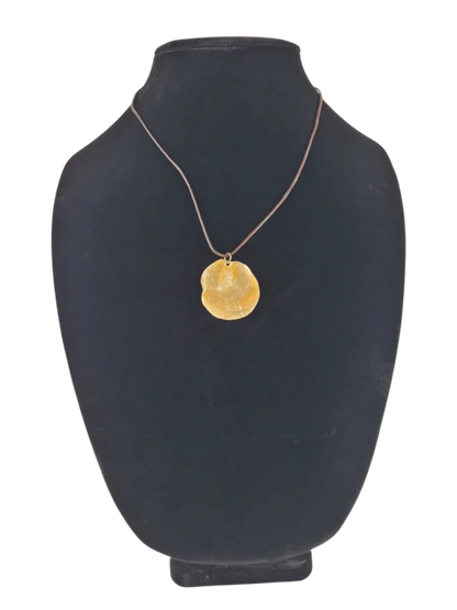 necklace with a pendant on a black mannequin bust