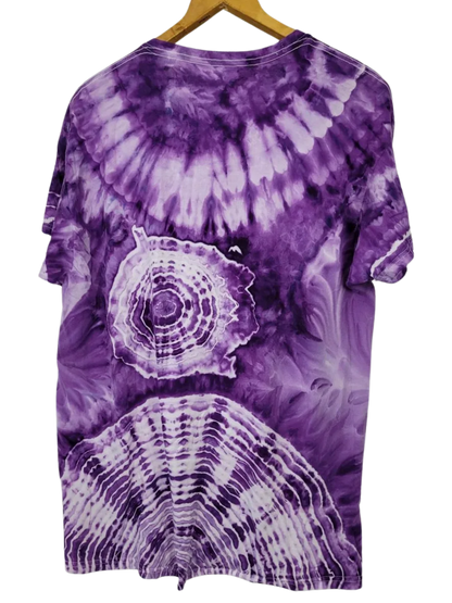 Purple tie-dye t-shirt with a circular pattern on a hanger against a white background
