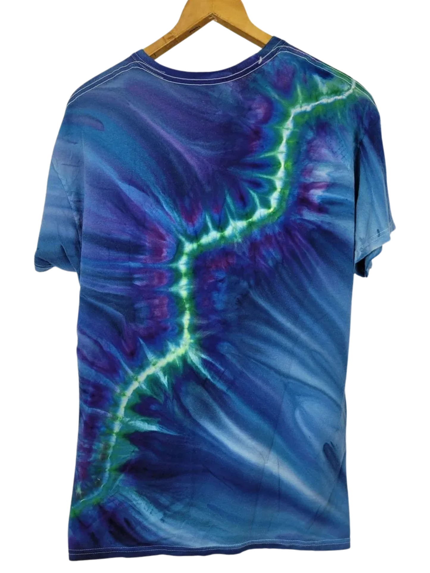Tie-dye t-shirt with blue and green patterns on a hanger