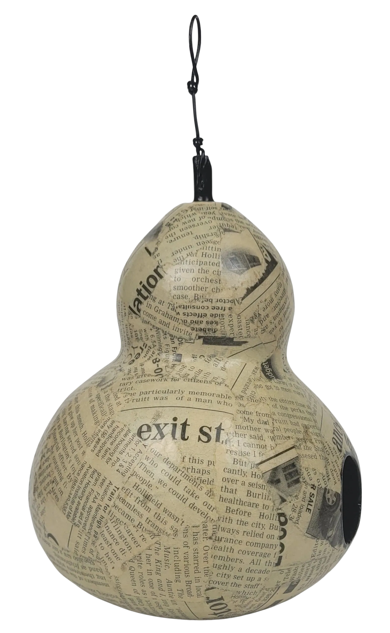 Decorative gourd made from newspaper with text and graphics on a white background