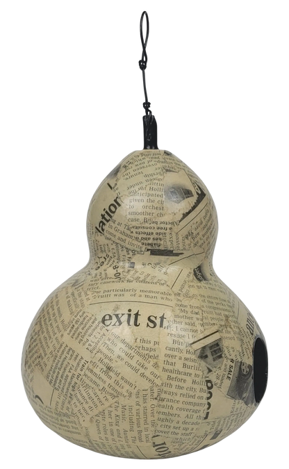 Decorative gourd made from newspaper with text and graphics on a white background