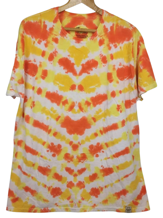 Tie-dye t-shirt with orange and yellow pattern on a white background