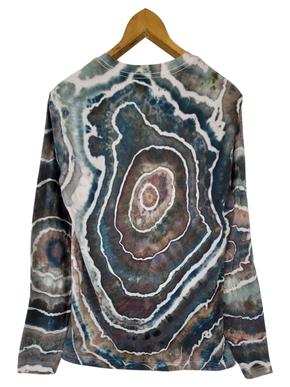 Sweatshirt with geode pattern on a hanger against a white background