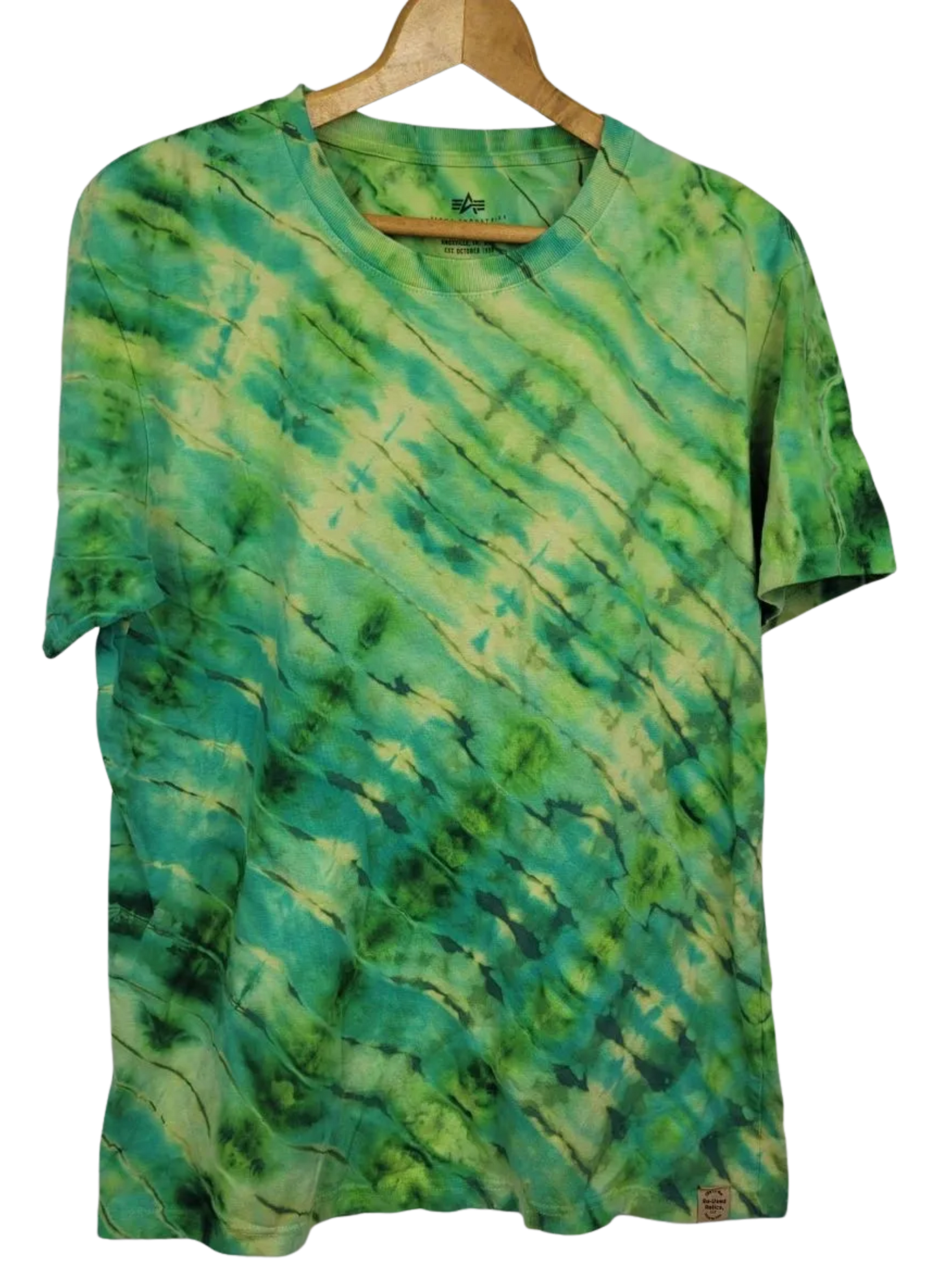 Green tie-dye t-shirt on a hanger against a white background
