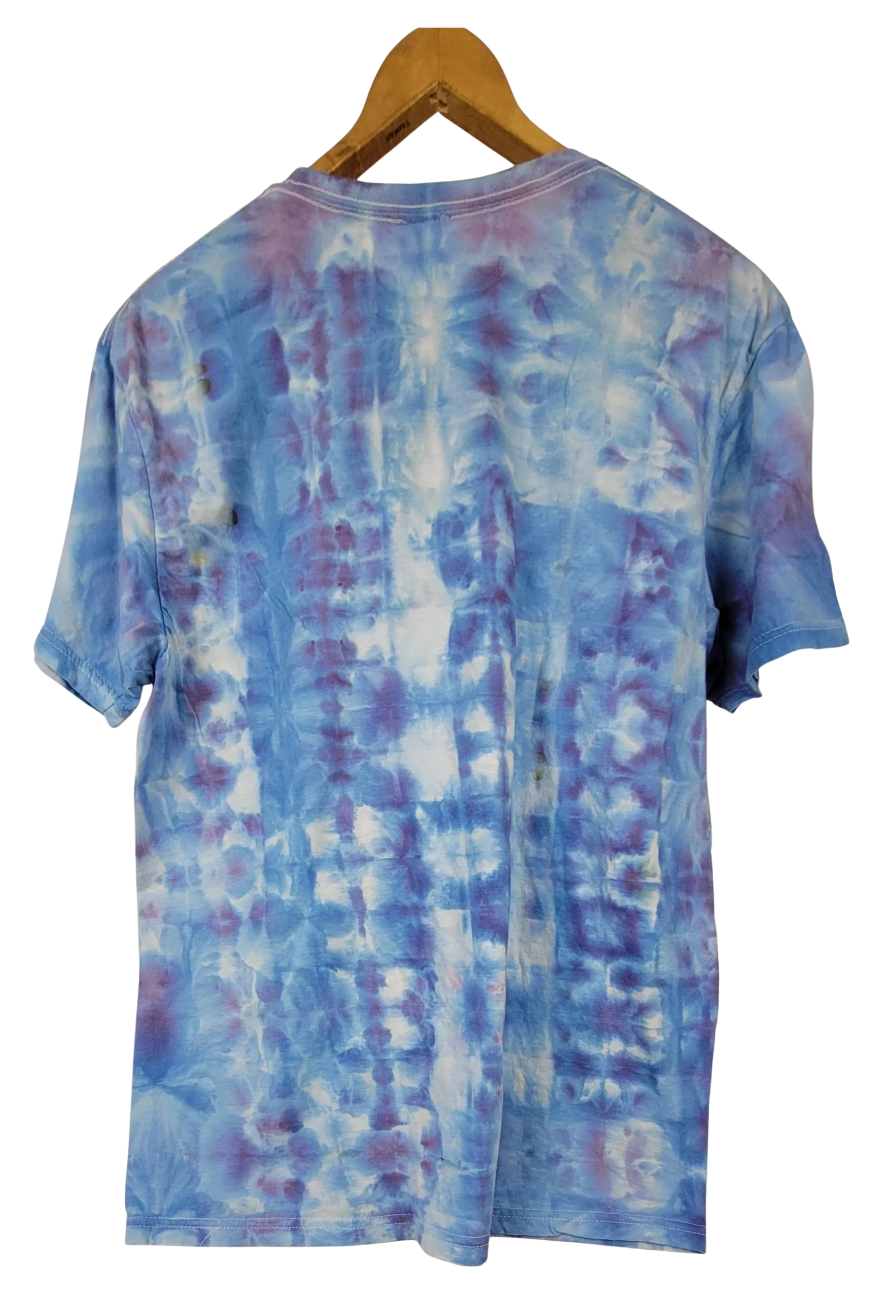 Blue tie-dye t-shirt on a wooden hanger with a white background