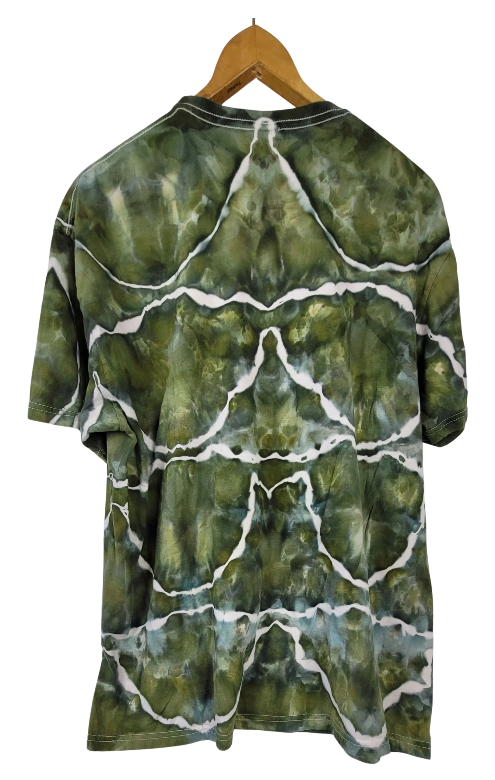 Green tie-dye t-shirt on a wooden hanger against a white background